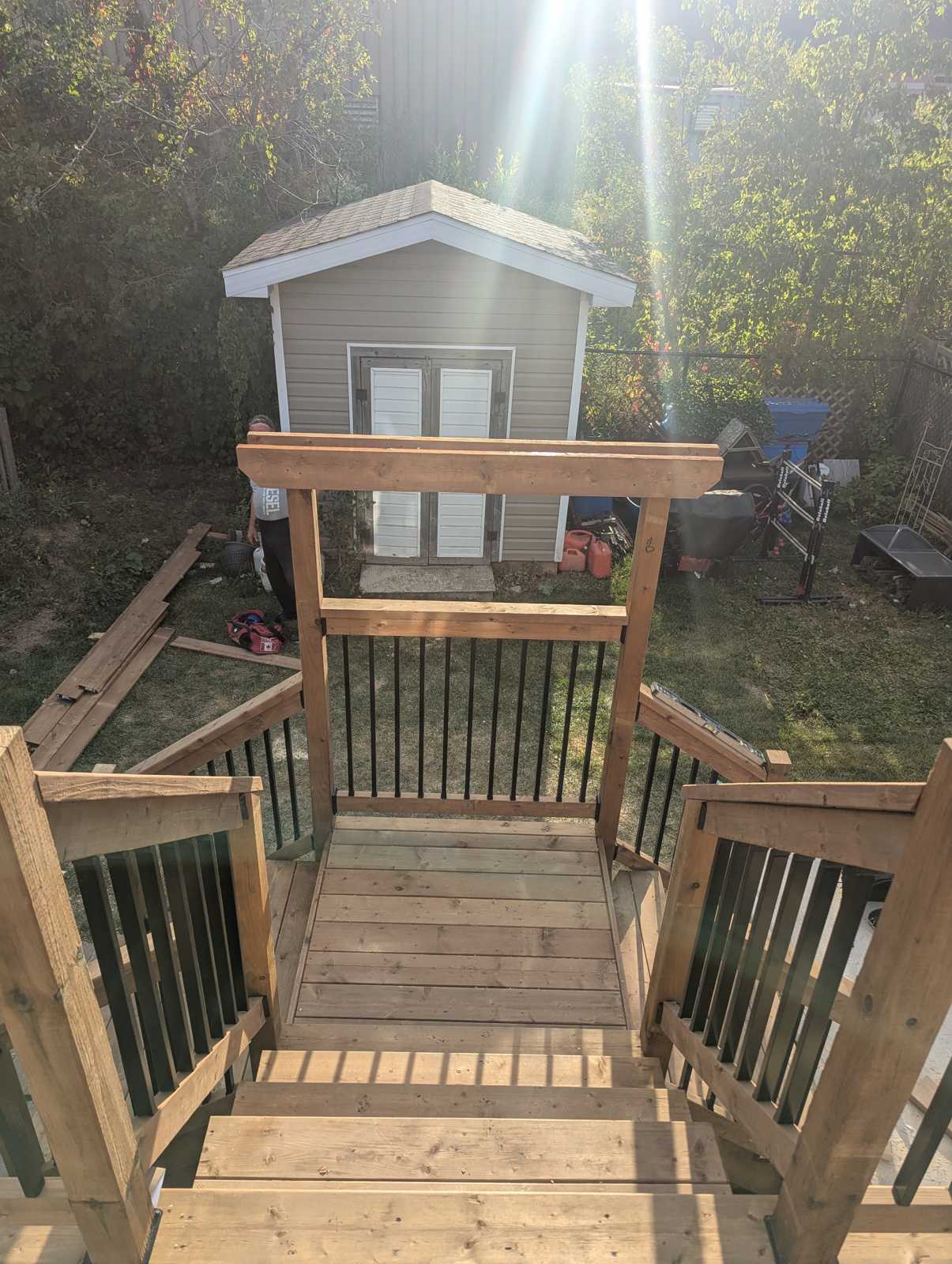 New deck stairs with black aluminum balusters, Ayers Avenue