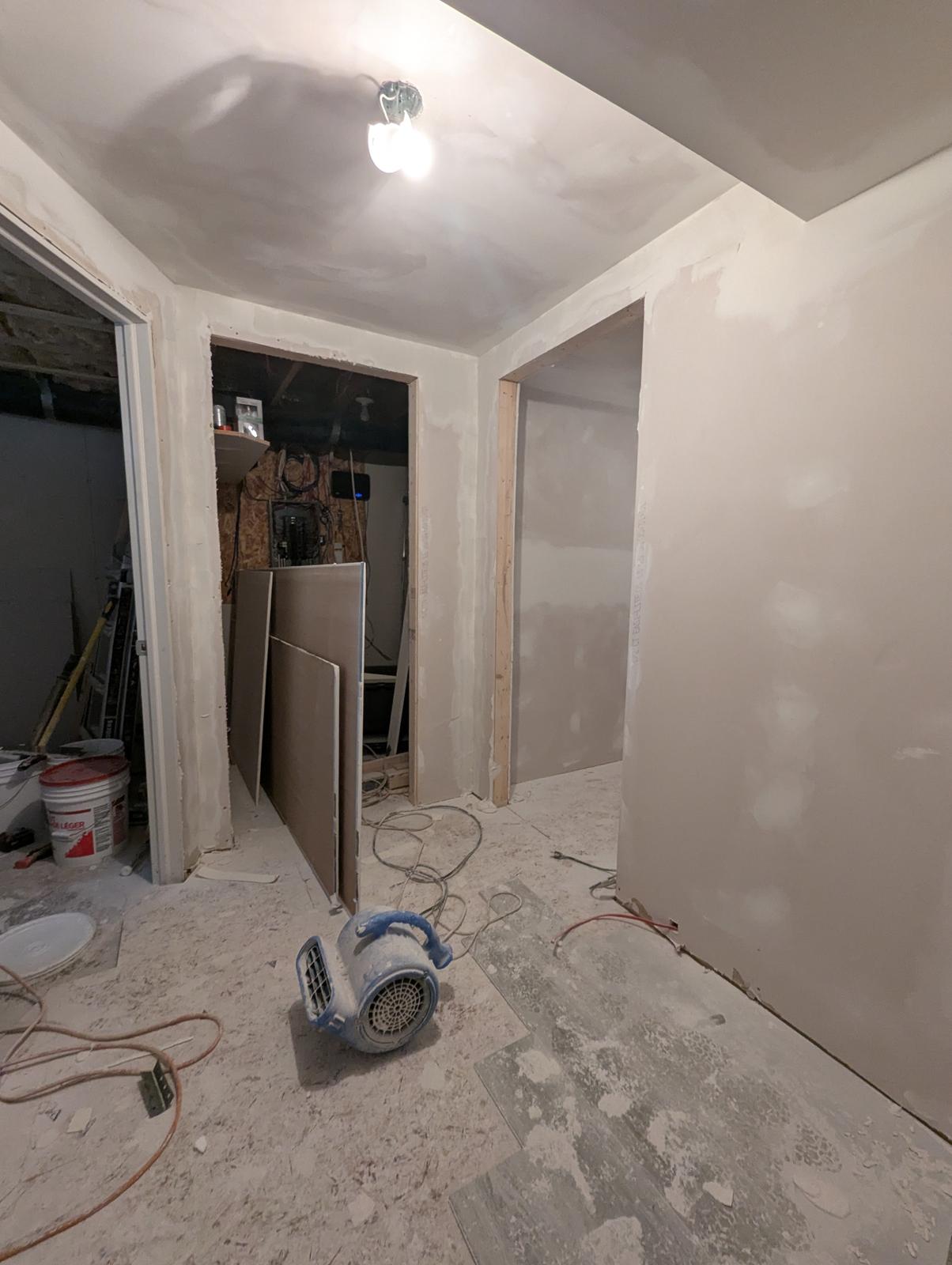 Basement hallway at drywall stage before flooring, Dieppe NB