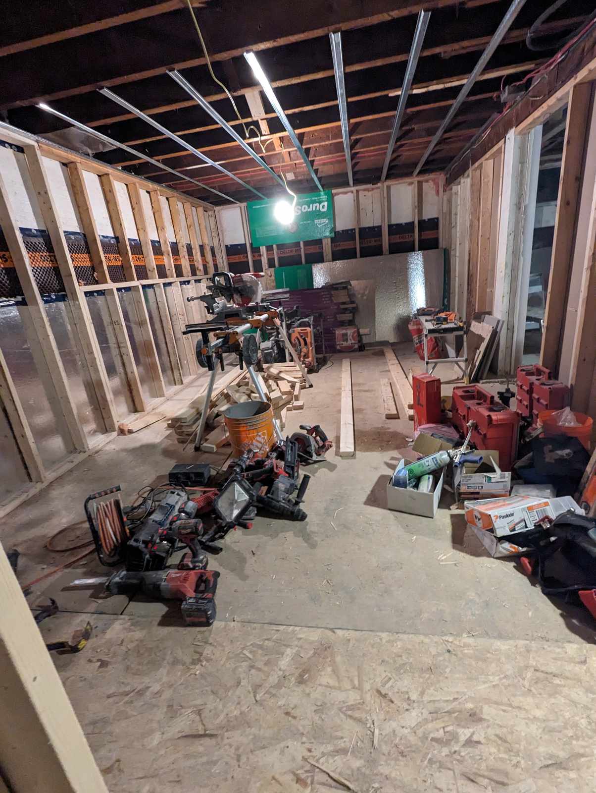 Steel ceiling strapping and electrical rough-in in a basement renovation, Riverview NB