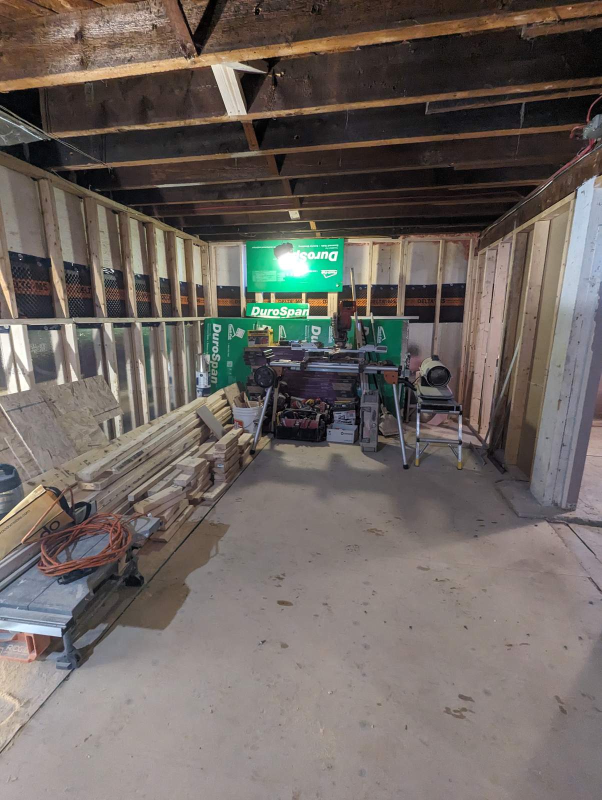 Basement stud walls framed over membrane and insulation, Riverview NB
