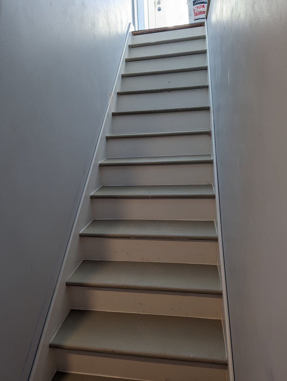 Finished painted basement stairs by Valhalla Construction, Riverview NB