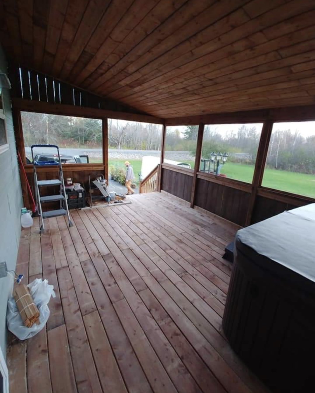 Interior of a covered deck with cedar ceiling built by Valhalla Construction