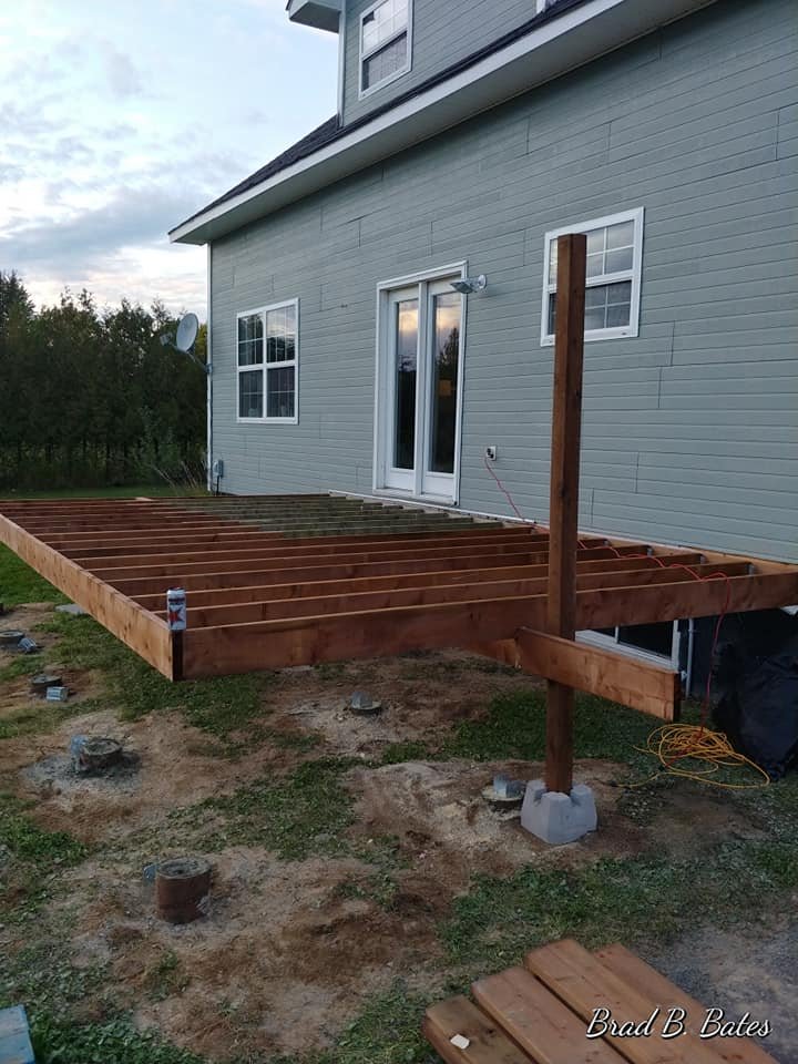 Elevated deck platform framing on posts before decking