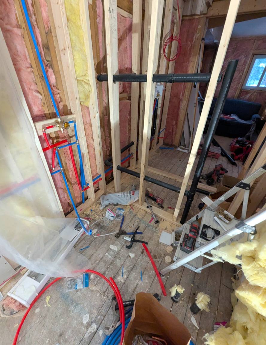 PEX supply lines and ABS drain stack roughed in for a bathroom remodel