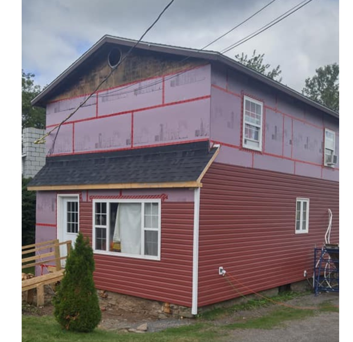 Finished siding repair section with new vinyl siding by Valhalla Construction