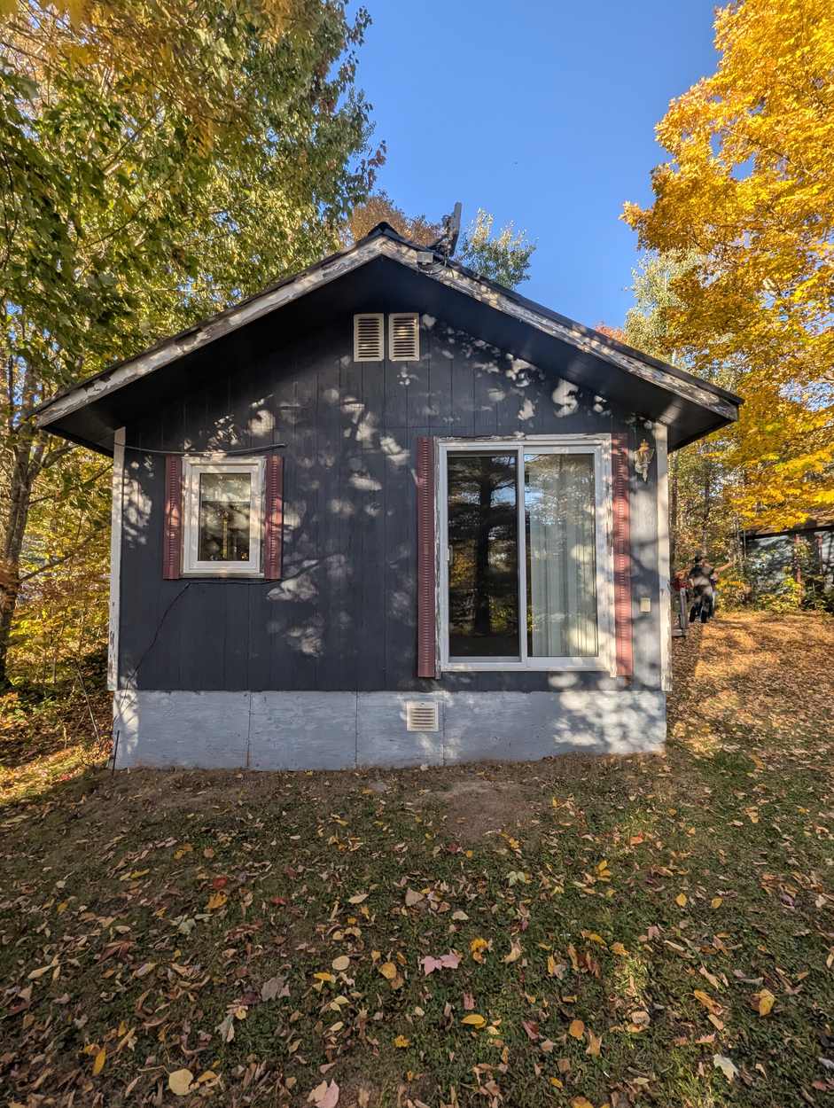 Gable end with weathered siding before exterior renovation