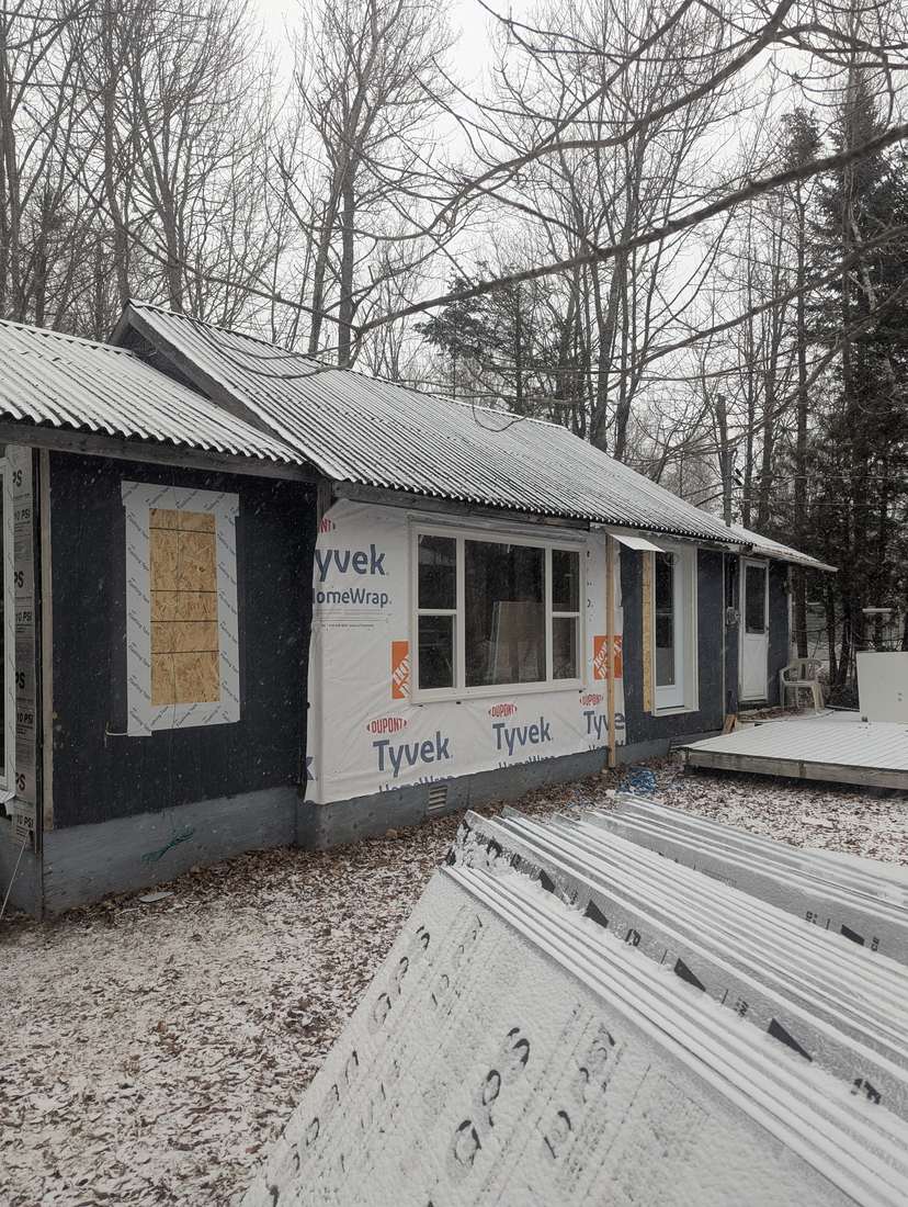 DuPont Tyvek HomeWrap installed over sheathing after old siding was stripped